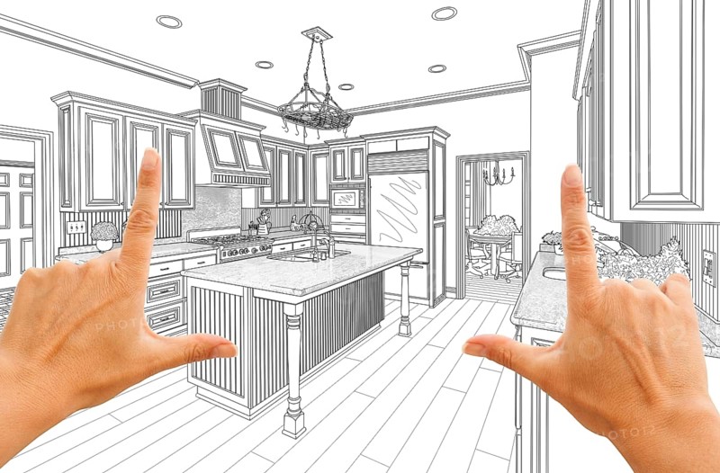 Female hands framing custom kitchen design drawing