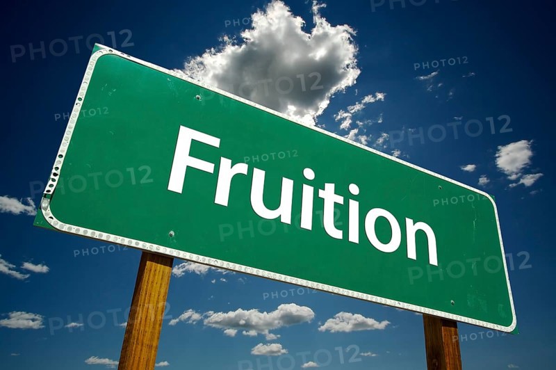 Fruition road sign with dramatic clouds and sky