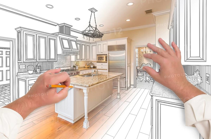 Male hands sketching with pencil A custom kitchen with photo showing through