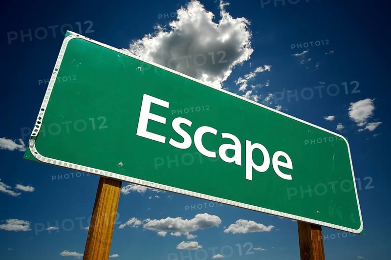 Escape road sign with dramatic clouds and sky