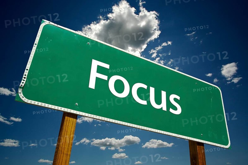 Focus road sign with dramatic blue sky and clouds