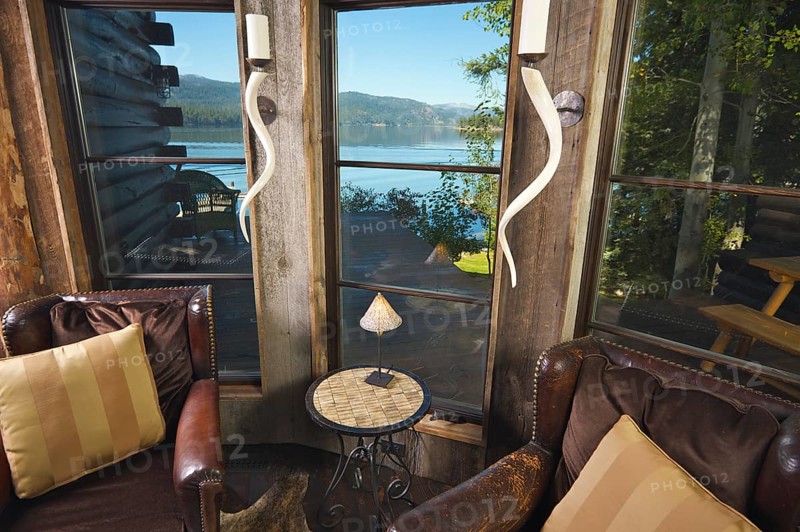 Luxurious rustic reading room in rural setting with lake view