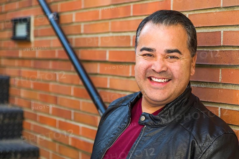 Headshot portrait of handsom hispanic man