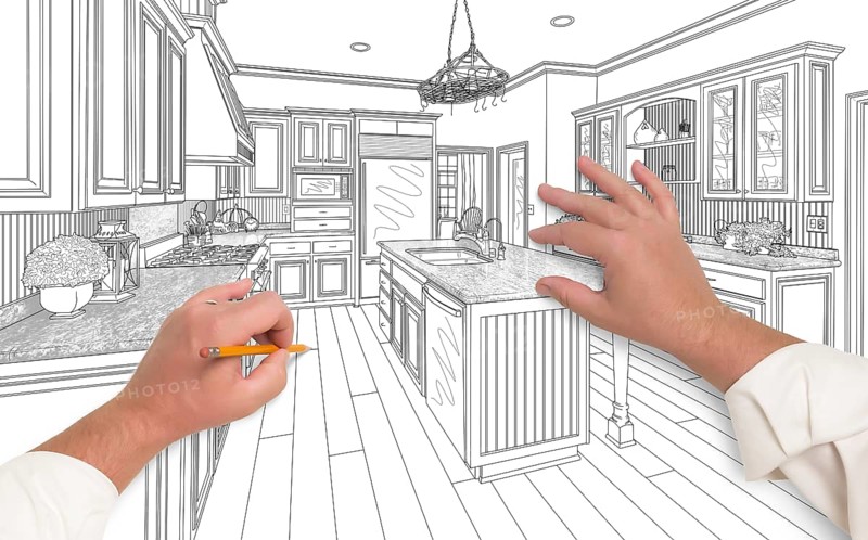 Male hands sketching with pencil the outline of a beautiful custom kitchen