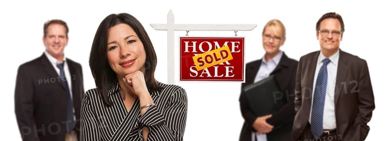 Pretty hispanic woman and other people behind in front of sold home for sale real estate sign isolated on a white background
