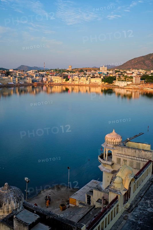 View of famous indian hinduism pilgrimage town sacred holy hindu religious city Pushkar amongst hills with Brahma mandir temple