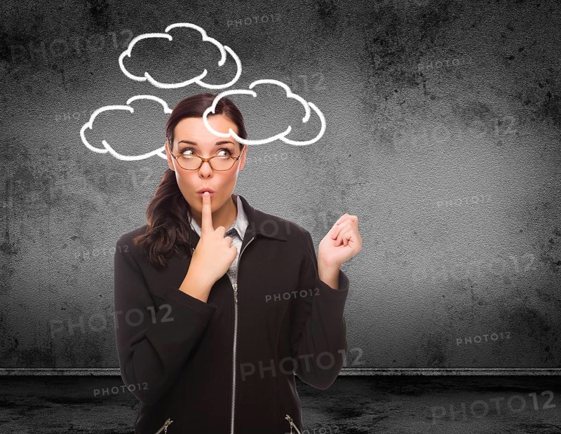 Clouds drawn around head of young adult woman in front of wall with copy space