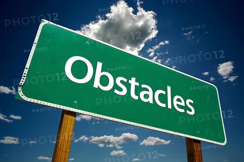 Obstacles road sign with dramatic clouds and sky