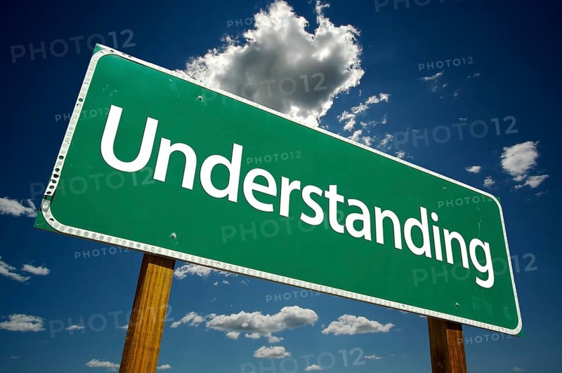 Understanding road sign with dramatic clouds and sky
