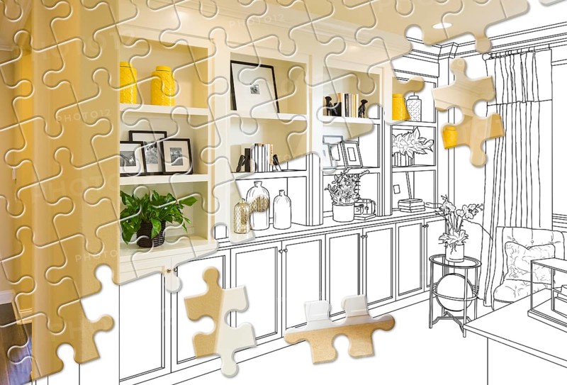 Puzzle pieces fitting together revealing finished built-in build over drawing