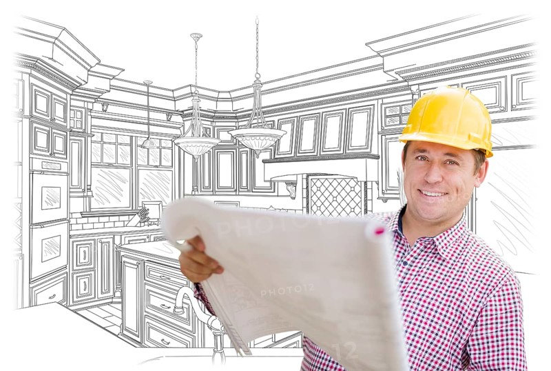 Smiling contractor holding blueprints over custom kitchen drawing