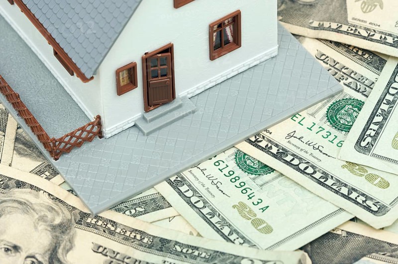 Home and money on a money background