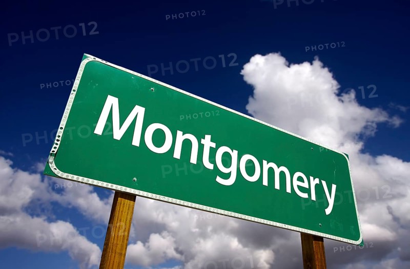 Montgomery road sign with dramatic blue sky and clouds