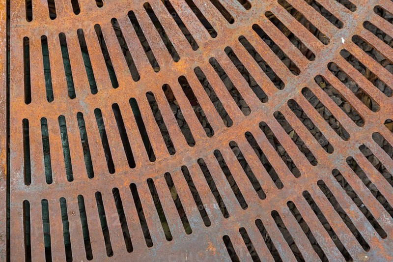 Rusty metal street grate