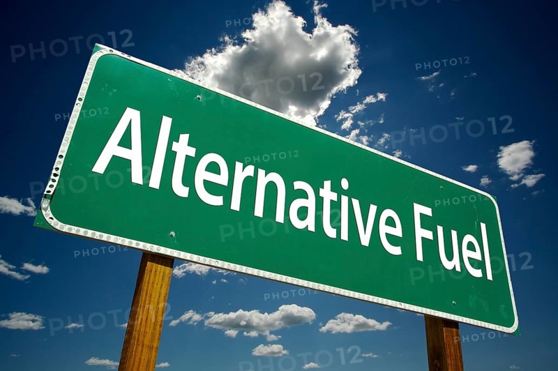 Alternative fuel road sign with dramatic clouds and sky