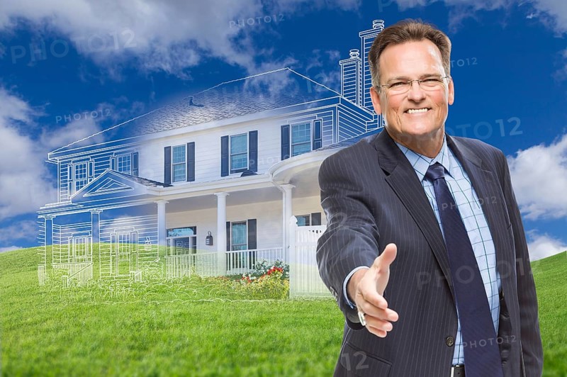 Smiling male agent reaching for hand shake in front of ghosted new house