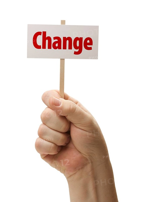 Change sign in male fist isolated on A white background