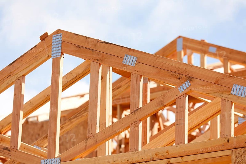 Abstract of wood home framing at construction site