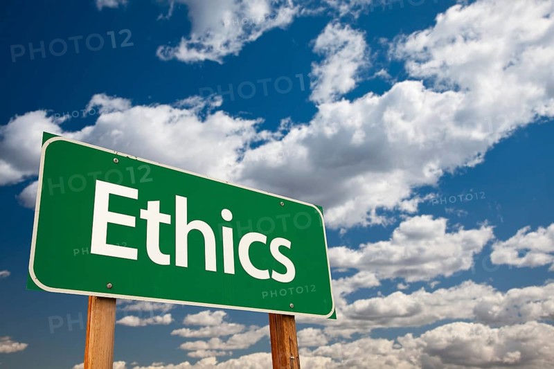 Ethics green road sign with copy room over the dramatic clouds and sky