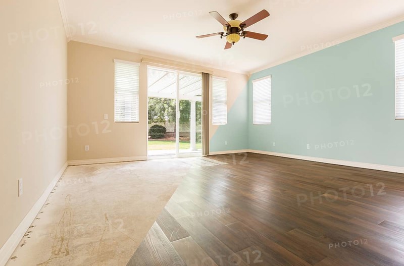 Empty room with cross section showing before and after with new wood floor and paint