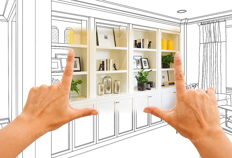 Hands framing custom built-in shelves and cabinets design drawing with section of finished photo