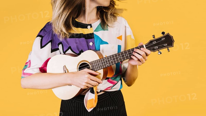 girl playing ukelele