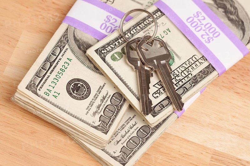 House keys on stack of money
