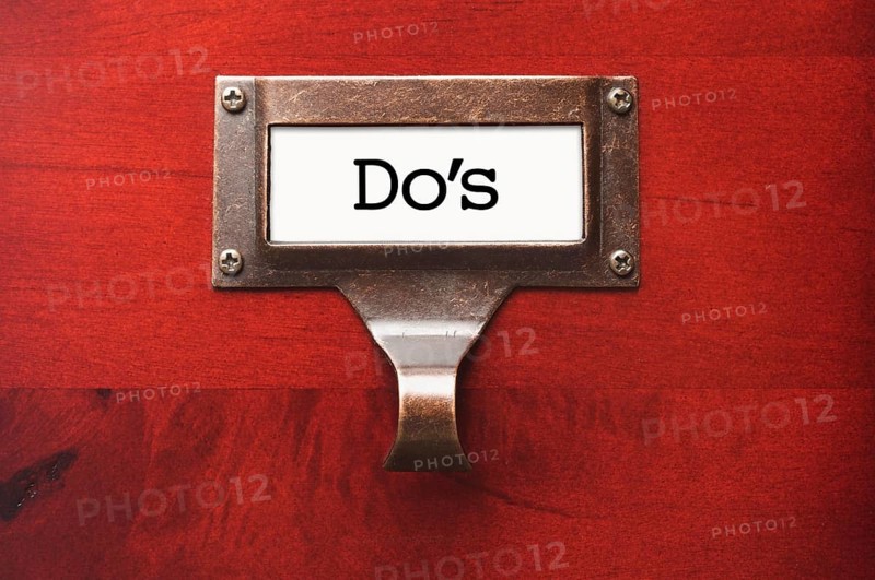 Lustrous wooden cabinet with do's file label in dramatic light