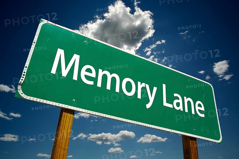 Memory lane road sign with dramatic clouds and sky