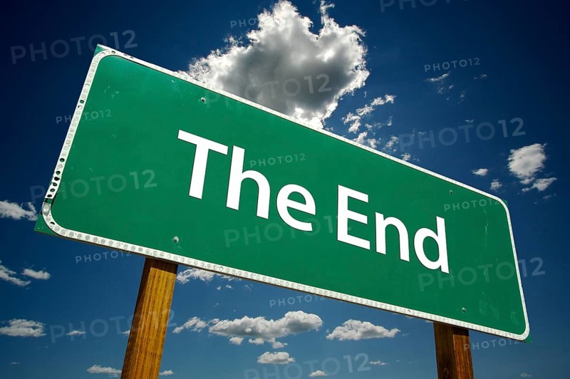 The end road sign with dramatic blue sky and clouds