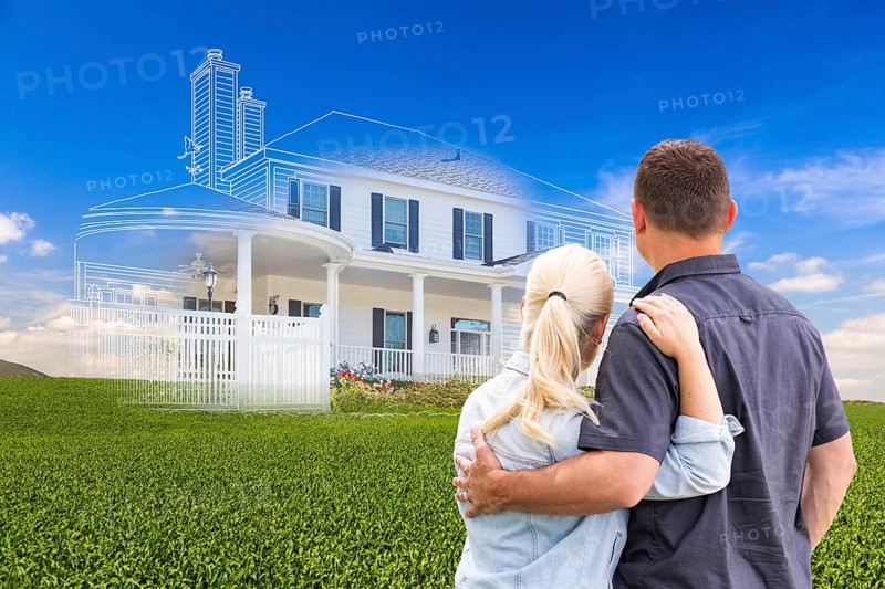 Couple facing ghosted house drawing and photo over green landscape