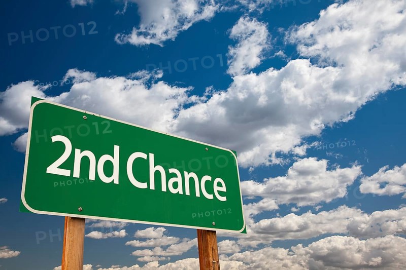 2nd chance green road sign and dramatic clouds background