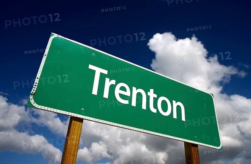 Trenton road sign with dramatic blue sky and clouds