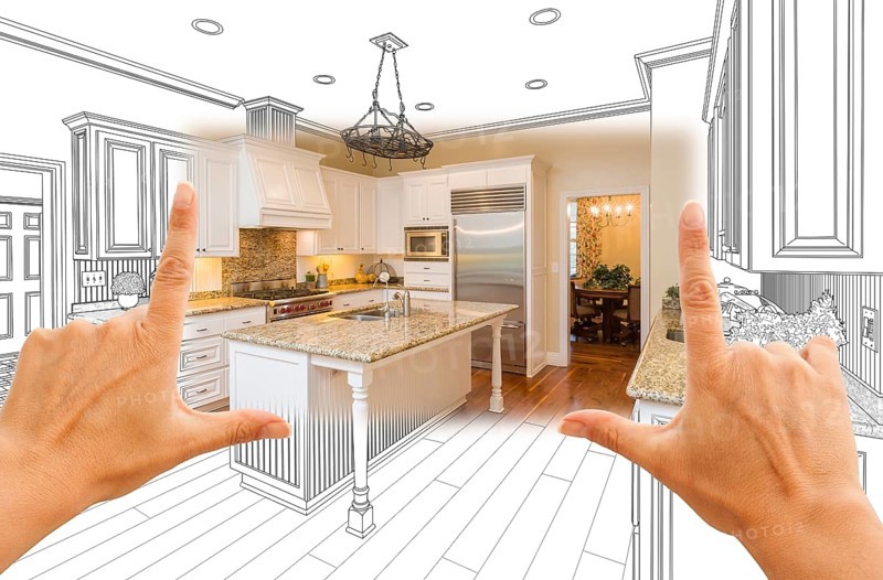 Female hands framing custom kitchen design drawing and square photo combination