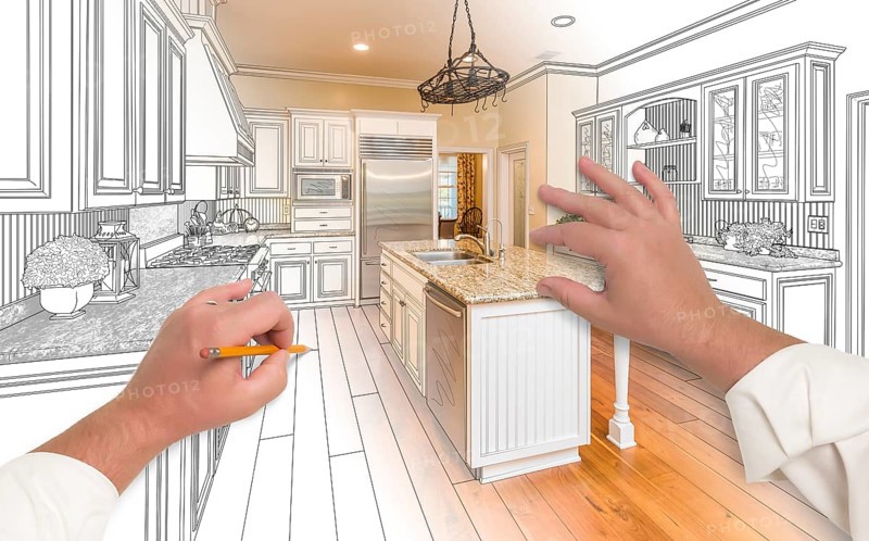 Male hands sketching with pencil A custom kitchen with photo showing through