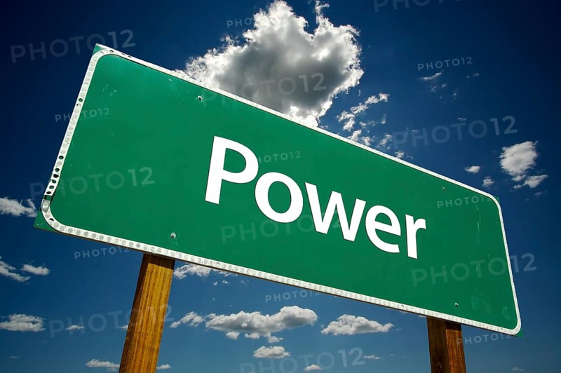 Power road sign with dramatic clouds and sky