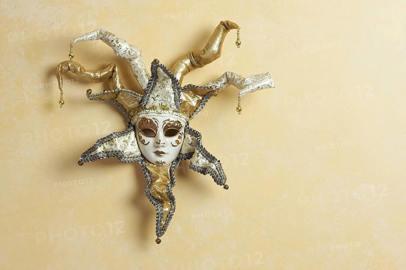 Beautiful venetian mask on light yellow wall