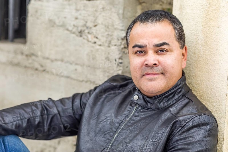 Headshot portrait of handsom hispanic man