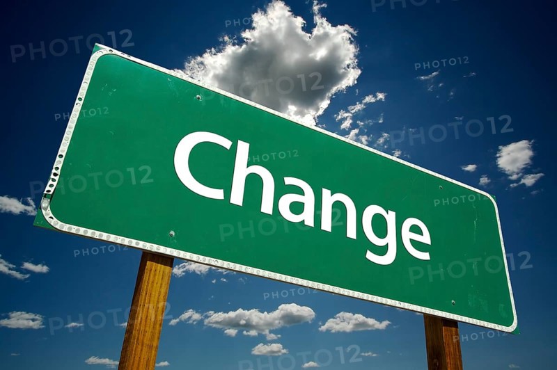 Change road sign with dramatic clouds and sky