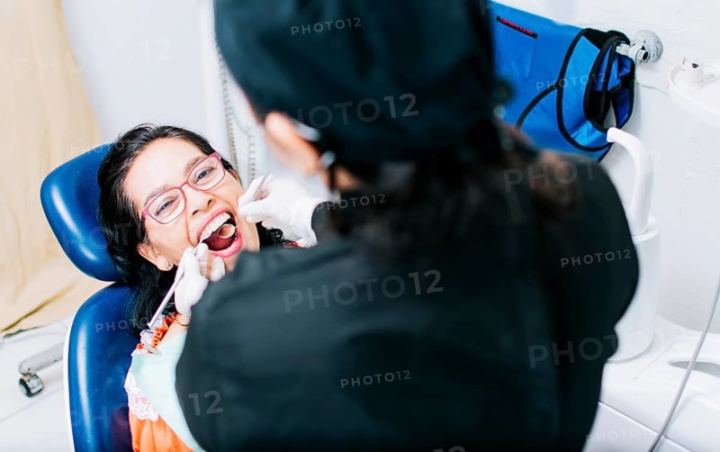 Top view of dentist doing dental checkup