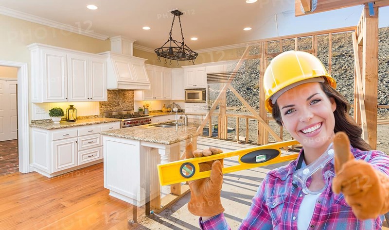 Female construction worker in front of house framing gradating to finished kitchen photo