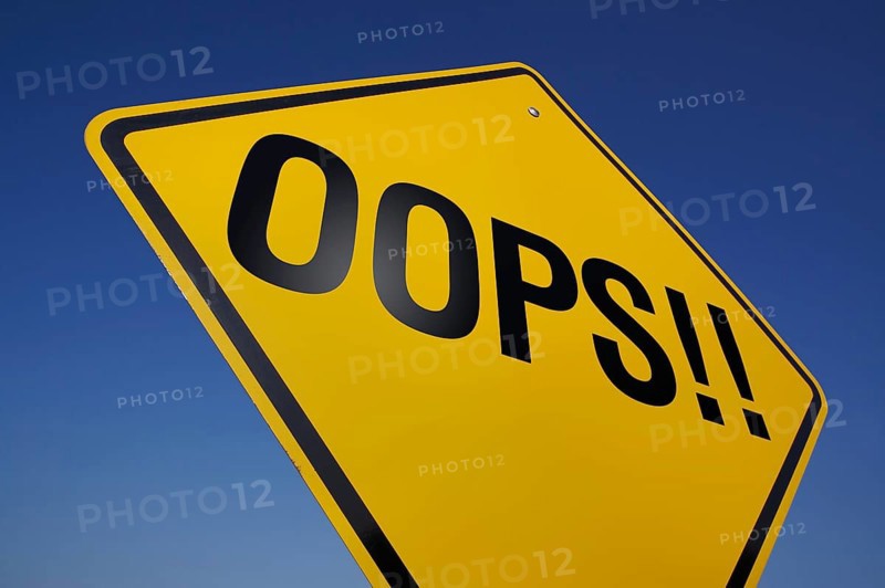 Yellow oops! road sign against A dramatic blue sky with clipping path