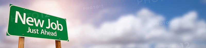 New job green road sign wide banner with room for text and dramatic clouds and sky