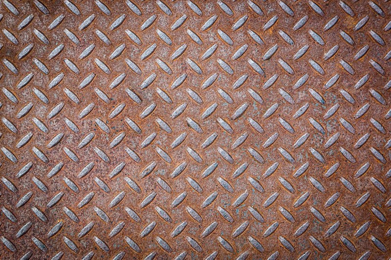 Rusty vignetted metal texture background