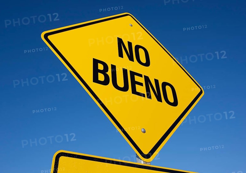 No bueno yellow road sign against a deep blue sky with clipping path