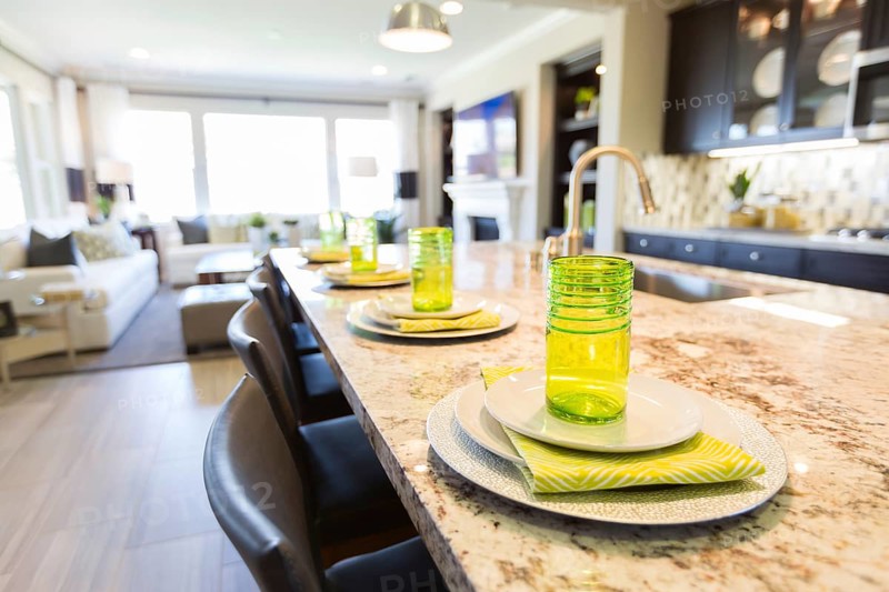 Abstract of beautiful kitchen granite counter place settings and chairs
