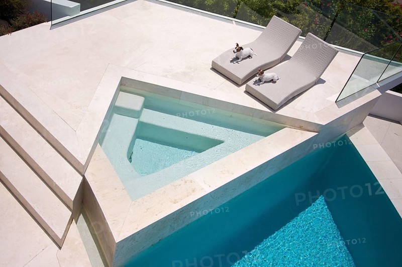 Custom luxury pool and chairs abstract with two jrts relaxing