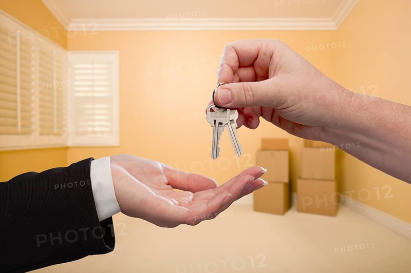 Handing over the house keys to A new home inside empty room