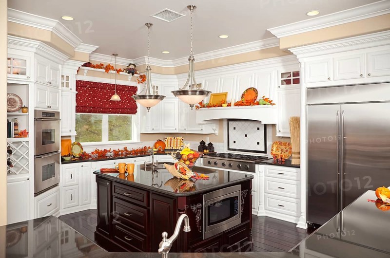 Beautiful custom kitchen interior with fall decorations in a new house