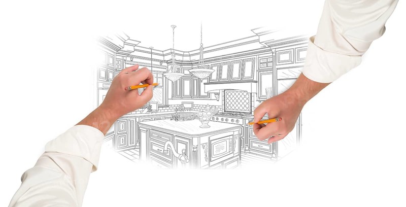 Two male hands sketching with pencil the outline of a beautiful custom kitchen